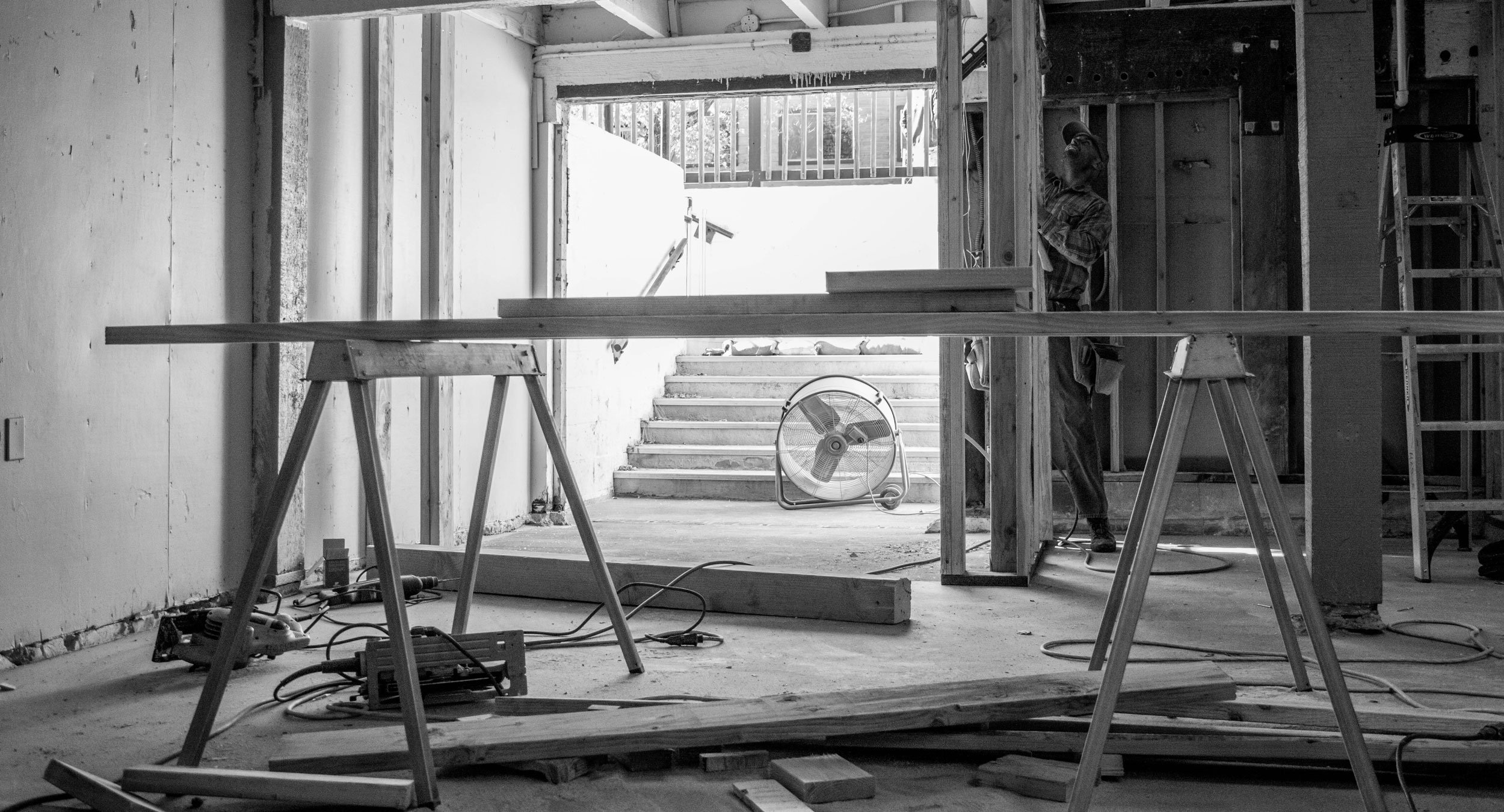 Black and white photo of construction indoors